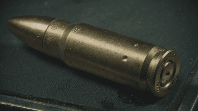 Copper-colored bullet and brass-colored cartridge case bullet