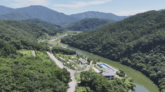 Beautiful river flowing along green mountains