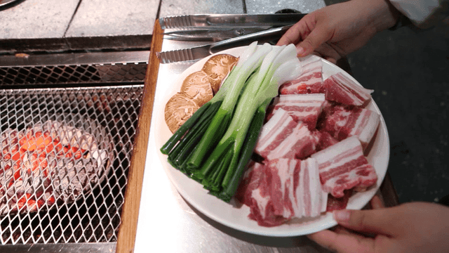 Prepared pork belly, green onions, and mushrooms