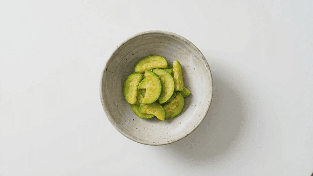 Seasoned zucchini served in ceramic bowl