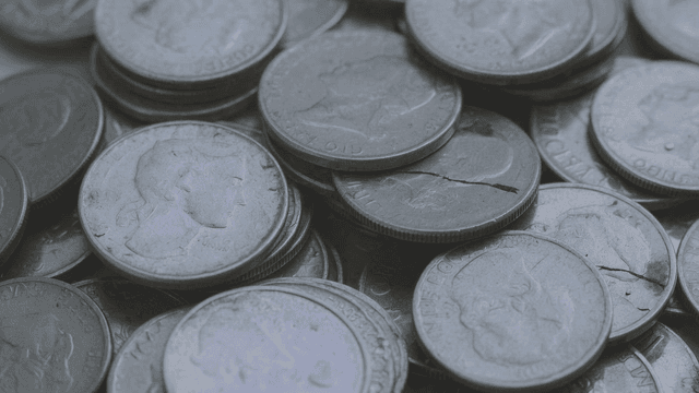 Piles of silver coins stacked layer upon layer