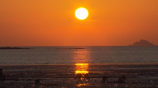 Low Tide Beach Colored by the Red Sky of Sunset