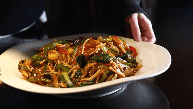 Eohyang Donggo stir-fried vegetable dish being served