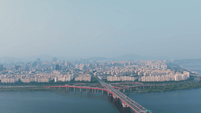 Seoul cityscape with Han River and grand bridge