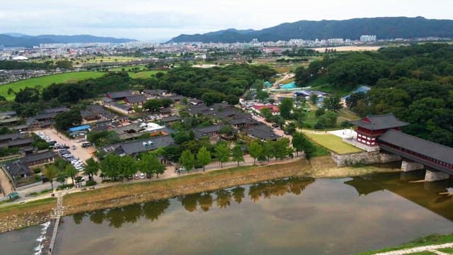 Traditional Korean village with surrounding cityscape