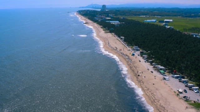 Peaceful Beach with Sparkling Sea Water