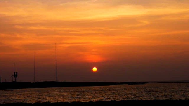 Sunset over a serene coastal seascape