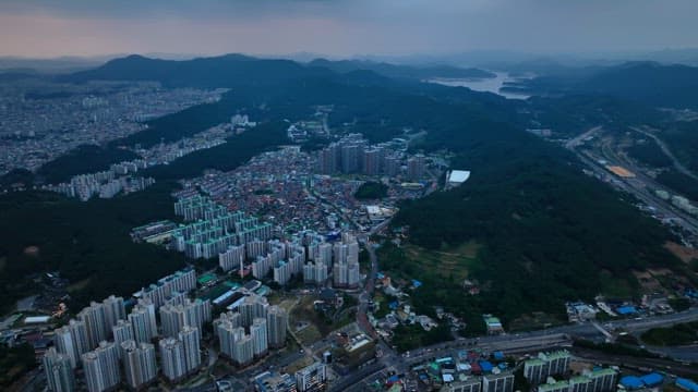 Sprawling city with surrounding mountains