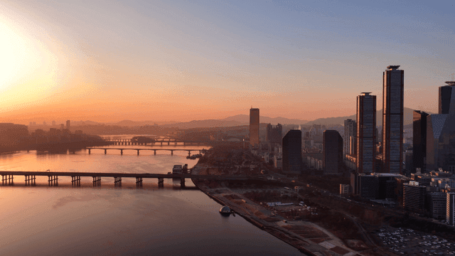 City skyline at sunset with river view