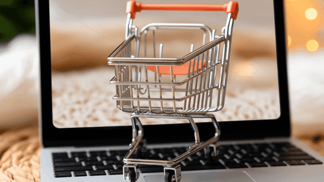 Shopping cart on a laptop keyboard