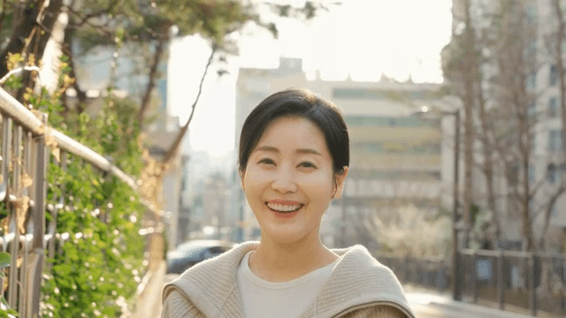 Woman smiling on a sunny street