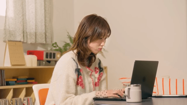 Woman working on a laptop indoors