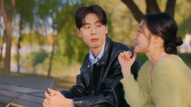 Couple talking on a park bench