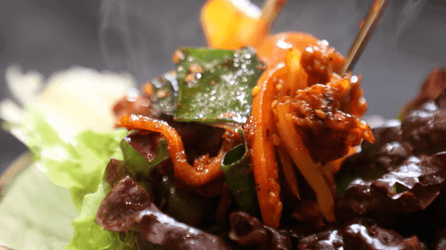 Spicy stir-fried pork served on lettuce