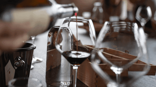 Wine being poured into a glass