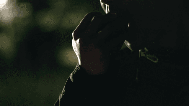 Man eating apple late at night