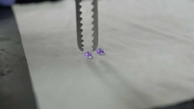 Moving a water droplet with forceps coated with a hydrophobic surface