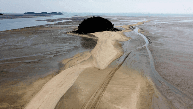 Sandy path leading to small island