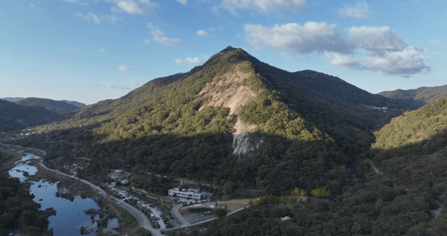 A scenic mountain landscape with a river