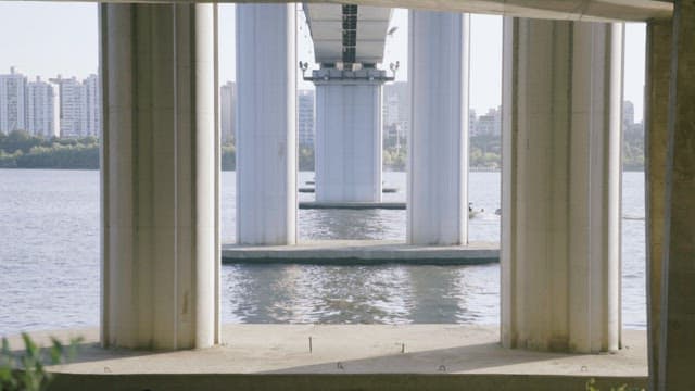 Water Skier Under the Bridge in the City