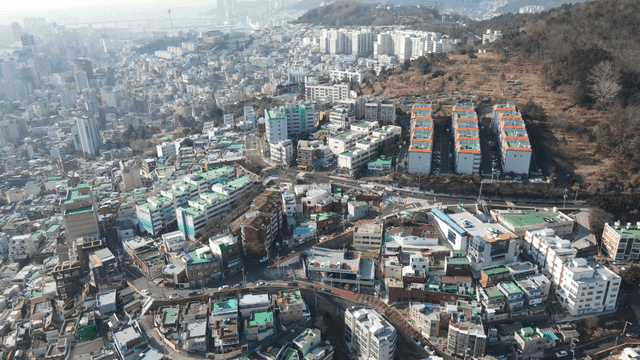 Sprawling city with surrounding hills