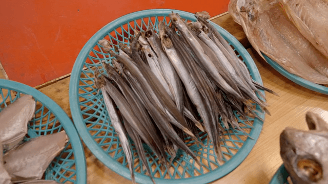 Various dried fish displayed at a market