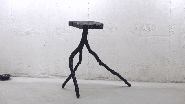 Unique wooden stool in a minimalist room