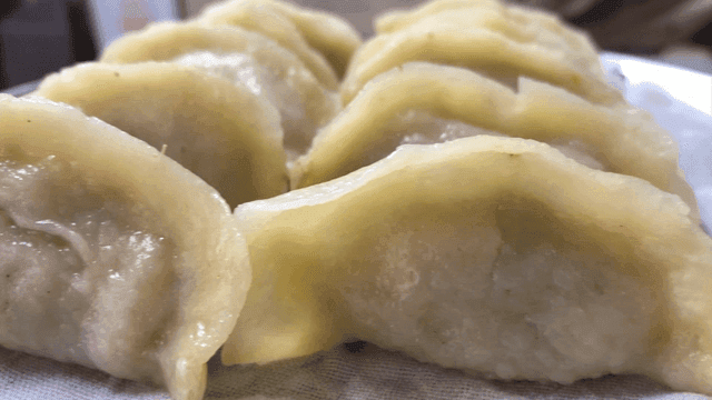 Steamed dumplings on a tray steamer