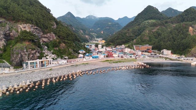 Coastal village surrounded by mountains