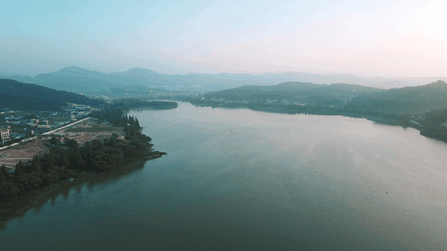 Tranquil lake surrounded by hills