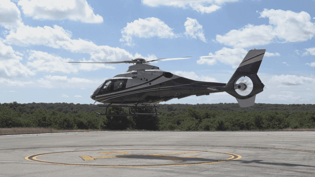 Helicopter taking off from helipad