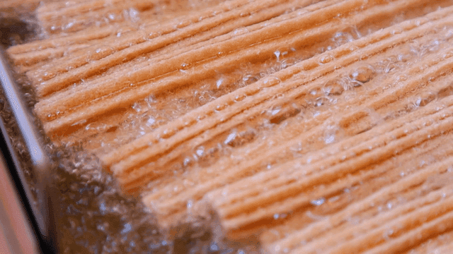 Churros frying in hot oil