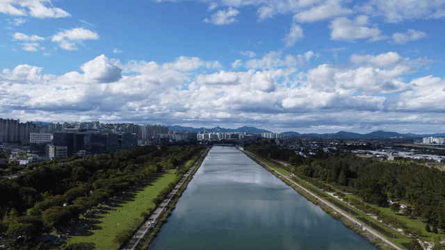 River cutting through city landscape.