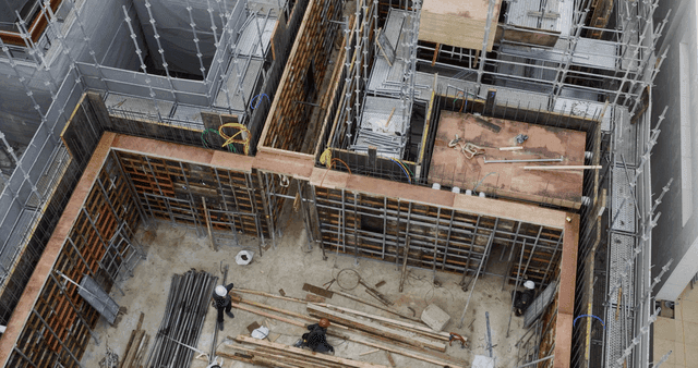 Construction site with workers and scaffolding
