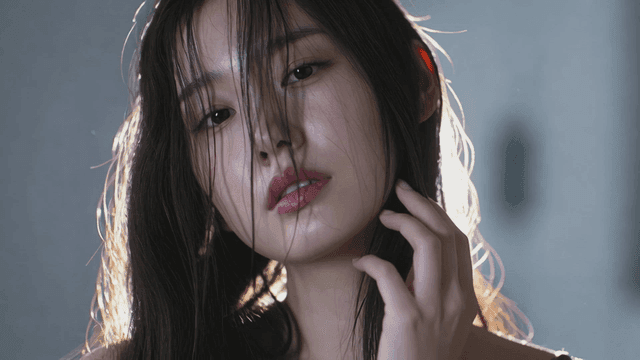 Woman with long hair under bright light