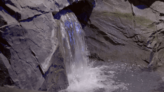 Water flowing over quiet artificial rocks