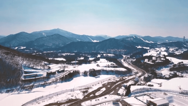Snow-covered mountains and roads