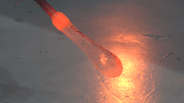 Glass art formed on rod