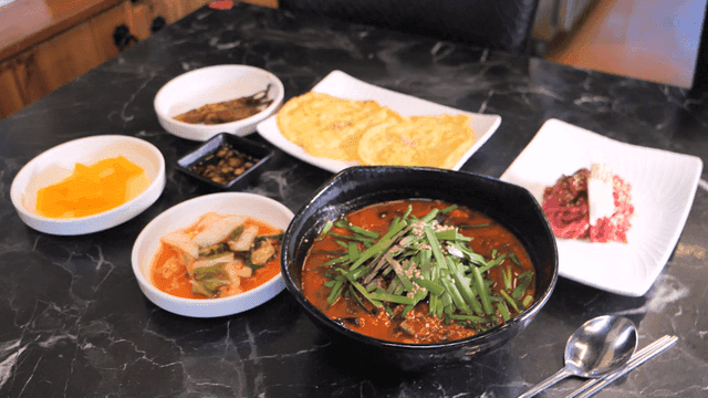 Table set with full course of soft tofu and jjambbong