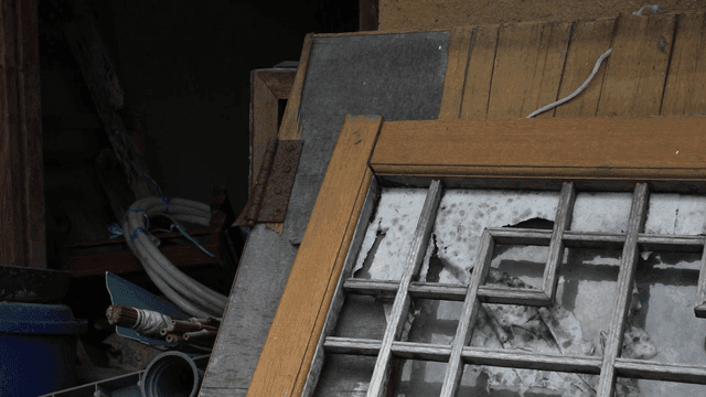 Old window frame with broken weatherstripping