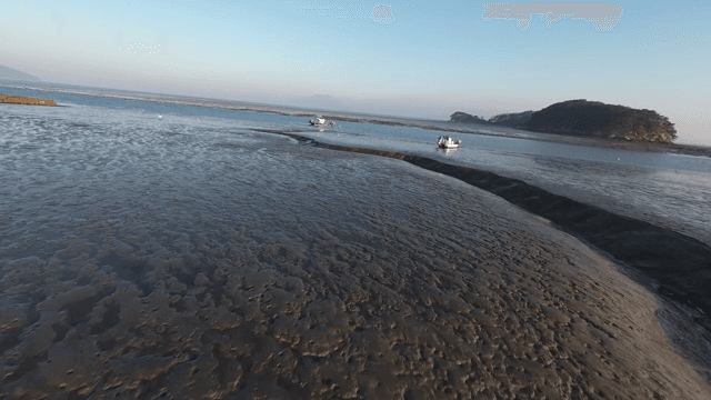 Serene coastal landscape with boats
