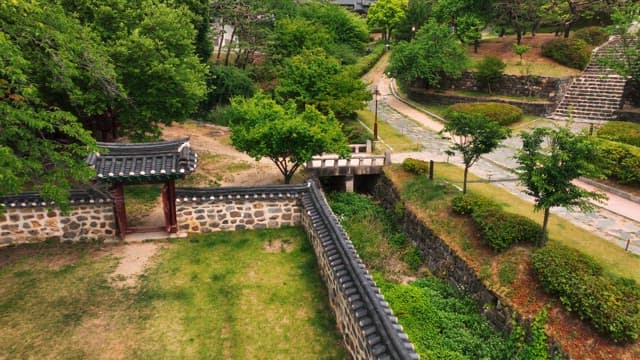 Traditional hanok village surrounded by lush trees