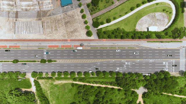 Aerial view of wide road with cars