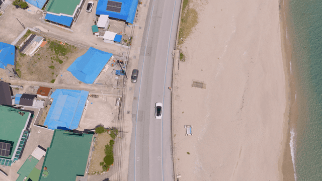 A coastal road with a scenic beach