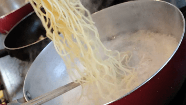 Noodles being cooked in a pot