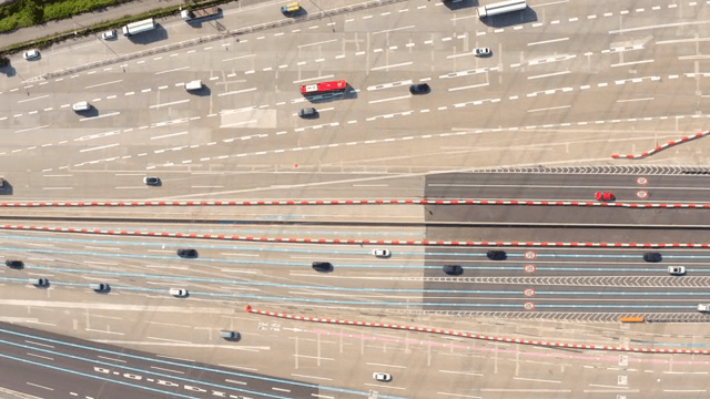 Busy highway with multiple lanes and vehicles