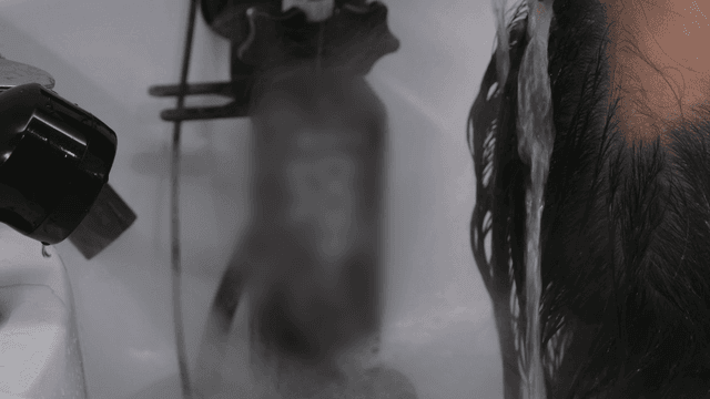 Hair being steam washed at beauty salon