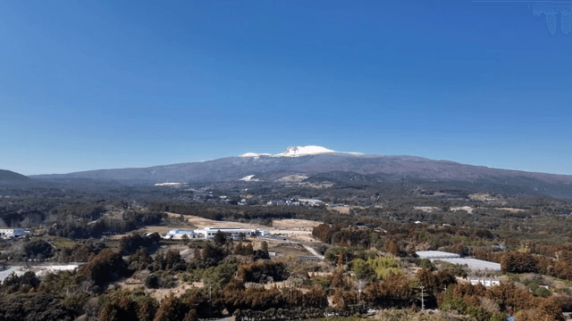 Vast landscape with a snow-capped mountain