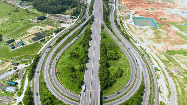 Aerial view of a highway surrounded by greenery