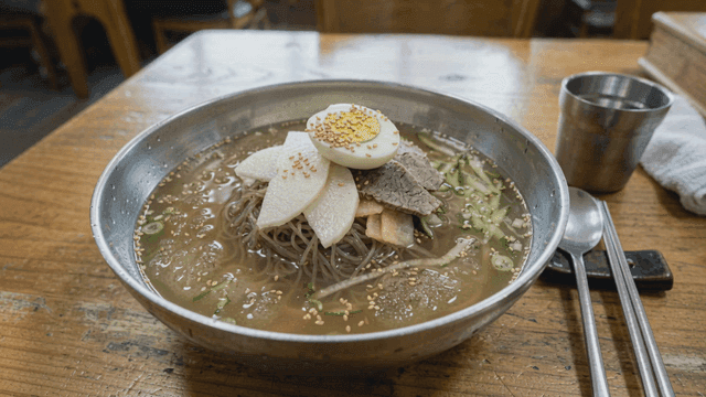 Bowl of cold noodles on table